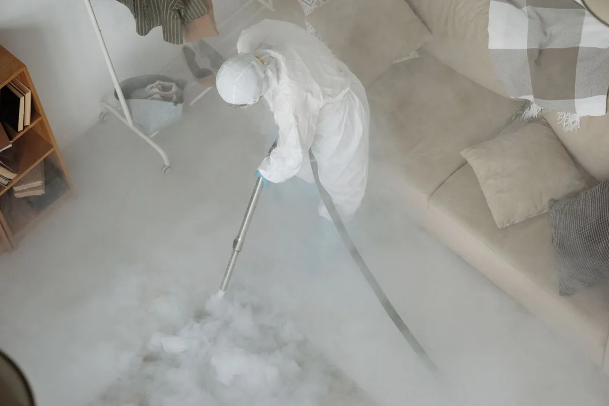Biohazard cleanup technician in protective equipment, Madison, WV